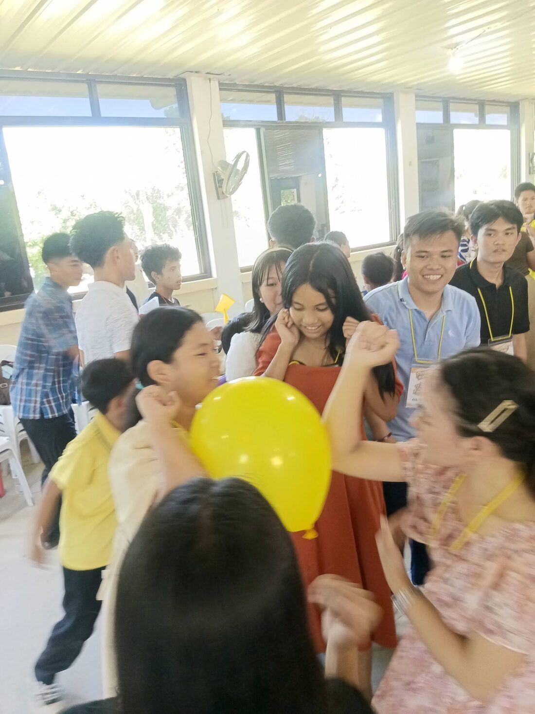 Young people enjoying fellowship and games at a youth gathering